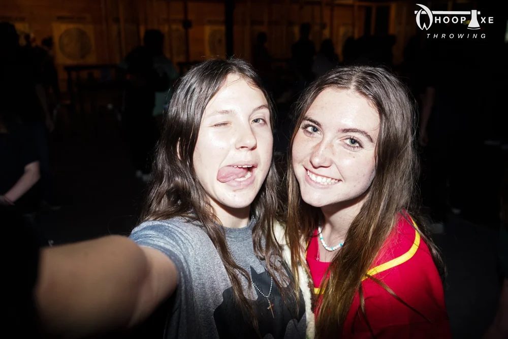 Two guests taking a selfie at an event